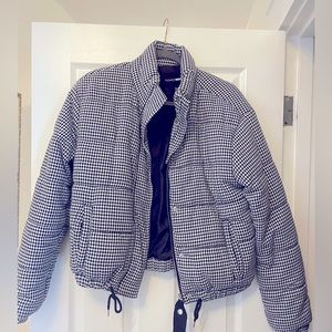 Black and white (houndstooth pattern) size M. Never been worn.